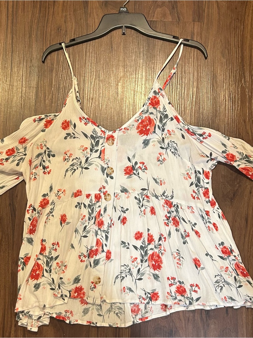 Torrid white floral blouse features a cold-shoulder design
